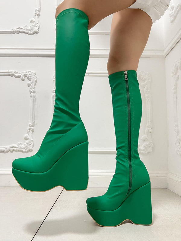 Green thigh-high boots
